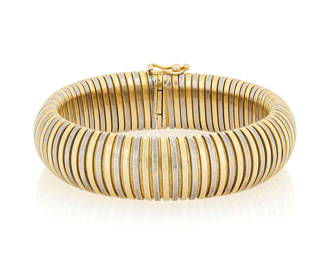 A 14K Bi-Color Gold Bracelet Of a tubogas design featuring alternating yellow and white gold (1 of 3)