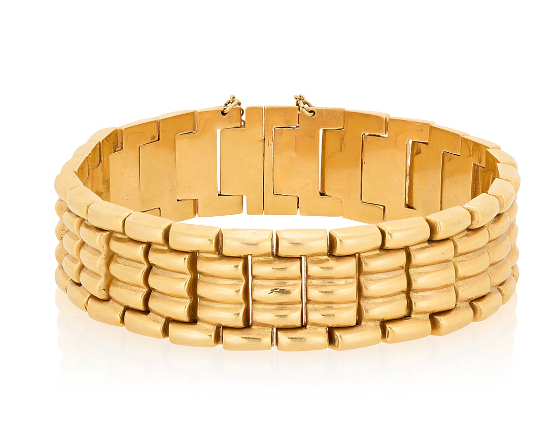 An 18K Gold Bracelet Of a high polish brick link design Length: 7 1/4 in., Width: 5/8 in. 31.2 (1 of 3)