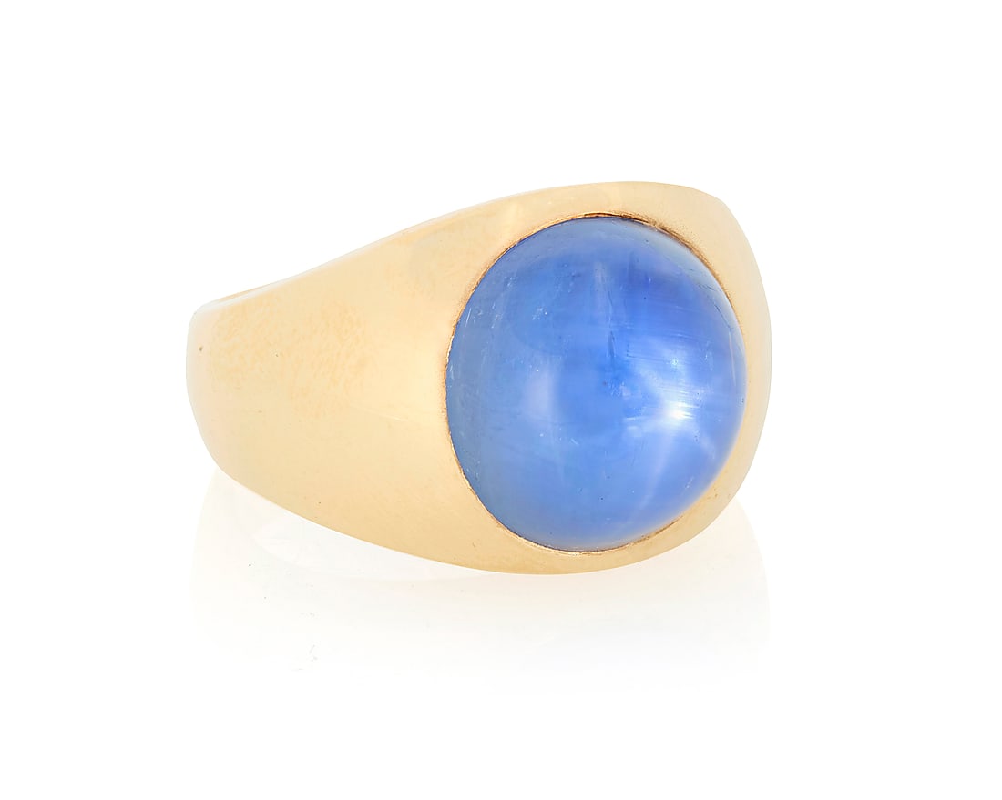 A 14K Gold and Star Sapphire Ring Featuring a cabochon star sapphire weighing approximately 16.74 (1 of 3)