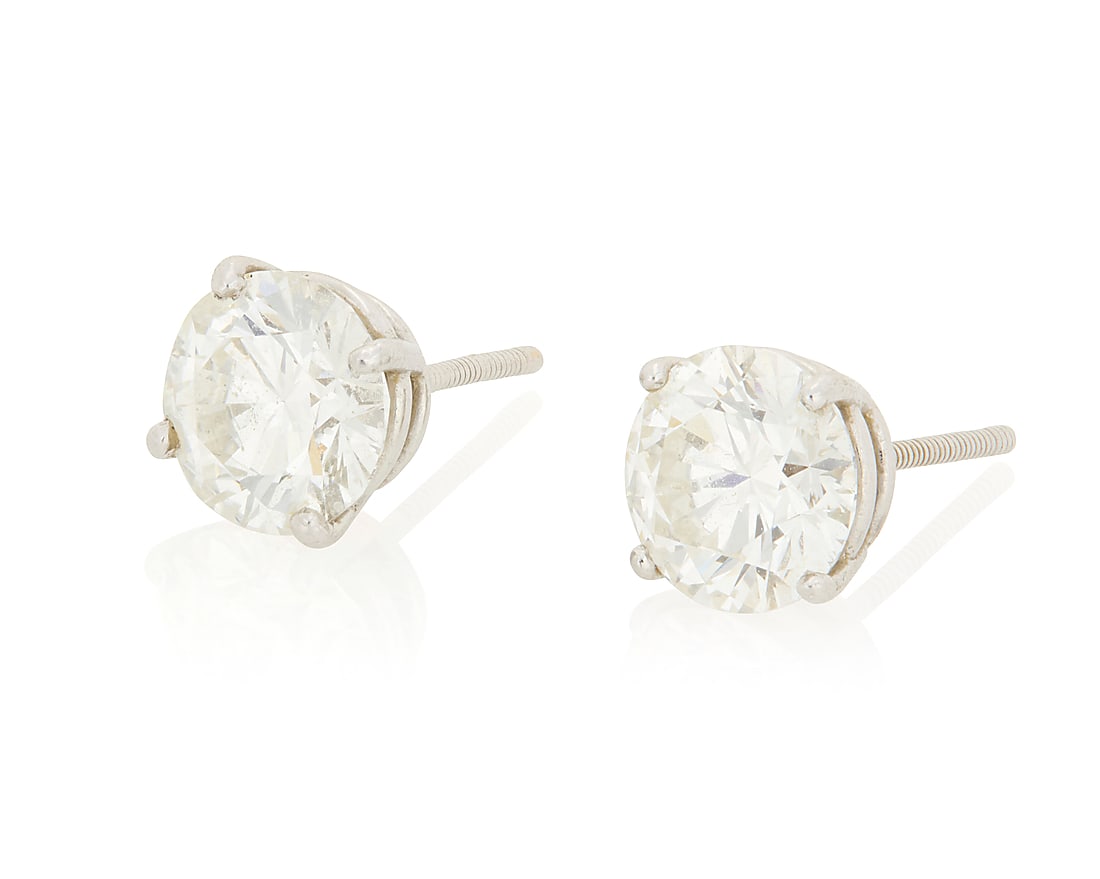 A Pair of Platinum and Diamond Stud Earrings Centering two round brilliant-cut diamond weighing (1 of 5)