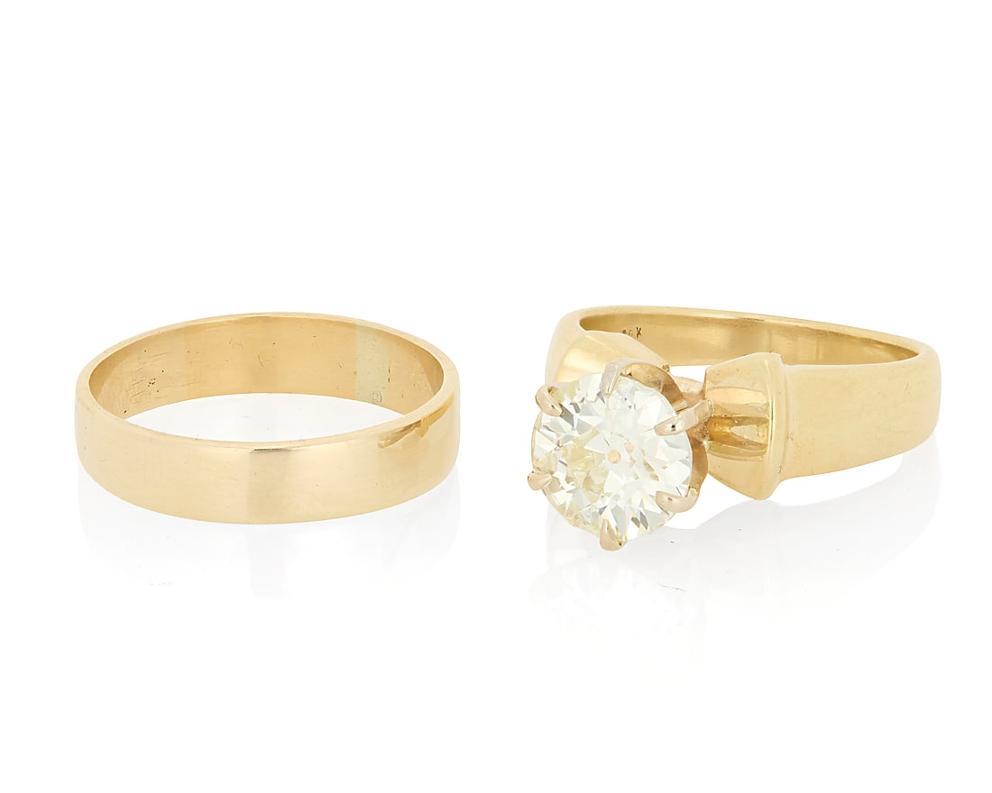 A 14K Gold and Diamond Ring Set Centering a round brilliant-cut diamond weighing 2.04 carats in a: A 14K Gold and Diamond Ring Set Centering a round brilliant-cut diamond weighing 2.04 carats in a high mount design together with a high polish gold band 2 pieces Size: 7 1/2 and 8 9.9 grams gross Acc