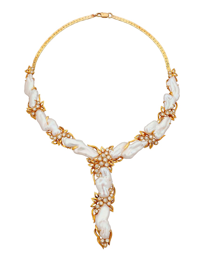 An 18K Gold, Baroque Cultured Pearl and Diamond Necklace Of a cascading design featuring baroque: An 18K Gold, Baroque Cultured Pearl and Diamond Necklace Of a cascading design featuring baroque cultured pearls accented by foliate motifs set with round diamonds weighing approximately 3.30 carats L