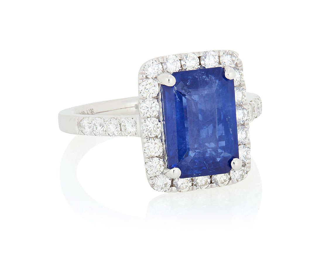A Platinum, Sapphire and Diamond Ring Centering an emerald-cut sapphire weighing approximately (1 of 4)