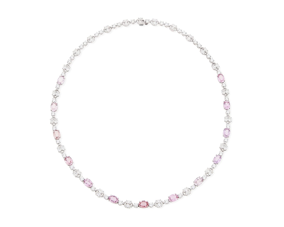 A Platinum, Pink Sapphire and Diamond Necklace Featuring thirteen pink sapphires 10.40 carats,: A Platinum, Pink Sapphire and Diamond Necklace Featuring thirteen pink sapphires 10.40 carats, accented by round and oval diamonds weighing approximately 10.15 carats Length: 17 in. 32.4 grams gross A