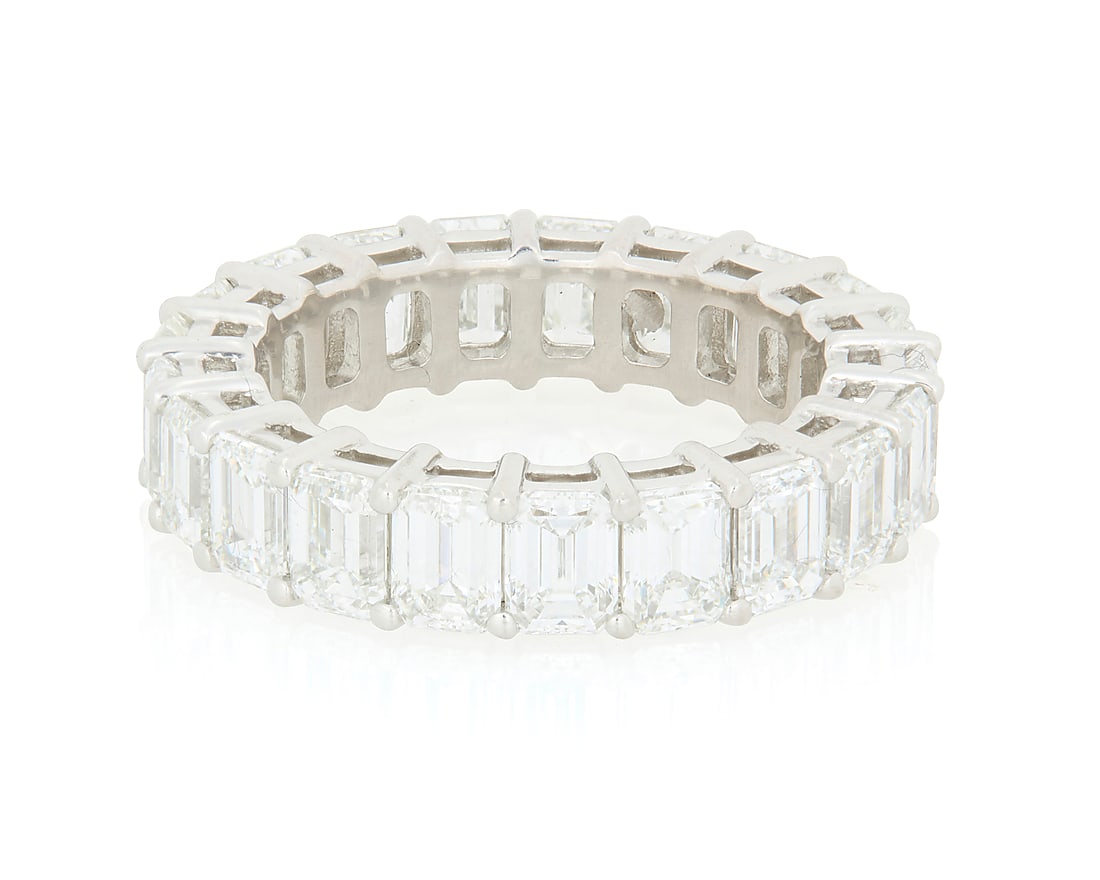 Tiffany & Co.: A Platinum and Diamond Eternity Ring Featuring twenty-one emerald-cut diamonds: Tiffany & Co.: A Platinum and Diamond Eternity Ring Featuring twenty-one emerald-cut diamonds weighing approximately 5.25 carats, signed Tiffany & Co., 60407495, with signed box Size: 5 1/4 6.4 grams