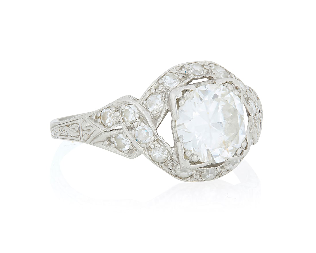 A Platinum and Diamond Ring Centering and old European-cut diamond weighing approximately 1.38 (1 of 4)