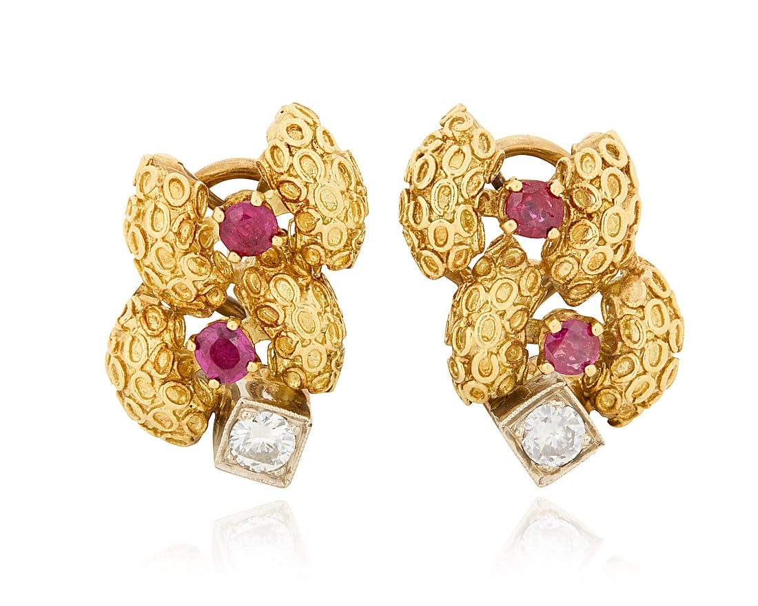 A Pair of 18K Gold, Ruby and Diamond Earrings Featuring a tentacle texture motif, accented by four: A Pair of 18K Gold, Ruby and Diamond Earrings Featuring a tentacle texture motif, accented by four round rubies and two round diamonds 2 pieces Measures: 7/8 x 1/2 in. 13.6 grams gross