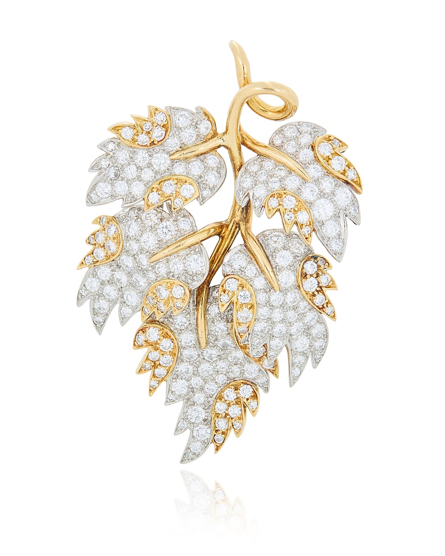 Schlumberger for Tiffany & Co.: An 18K Bi-Color Gold and Diamond Brooch Of a branch design: Schlumberger for Tiffany & Co.: An 18K Bi-Color Gold and Diamond Brooch Of a branch design featuring yellow and white gold leaves set with round diamonds weighing approximately 7.15 carats, signed Tif