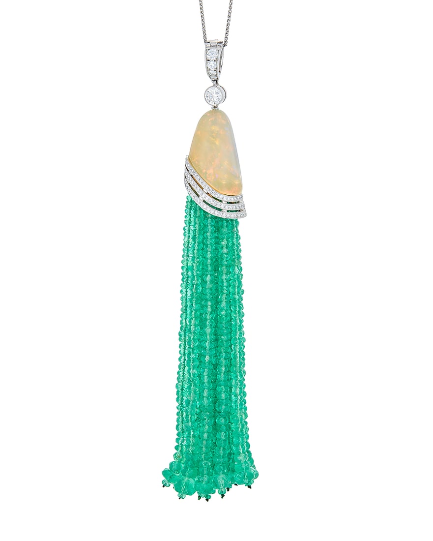 A Platinum, Opal and Emerald Necklace Featuring an organic carved opal suspending graduated: A Platinum, Opal and Emerald Necklace Featuring an organic carved opal suspending graduated emerald bead tassels, finished with round diamonds weighing approximately 1.54 carats Chain: 16 in., Pendant