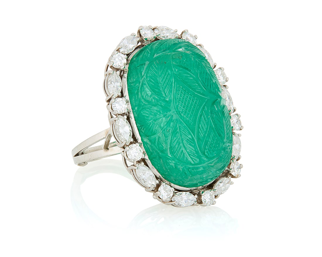 A Platinum, Emerald and Diamond Ring Featuring a caved emerald cabochon encircled by round and (1 of 4)