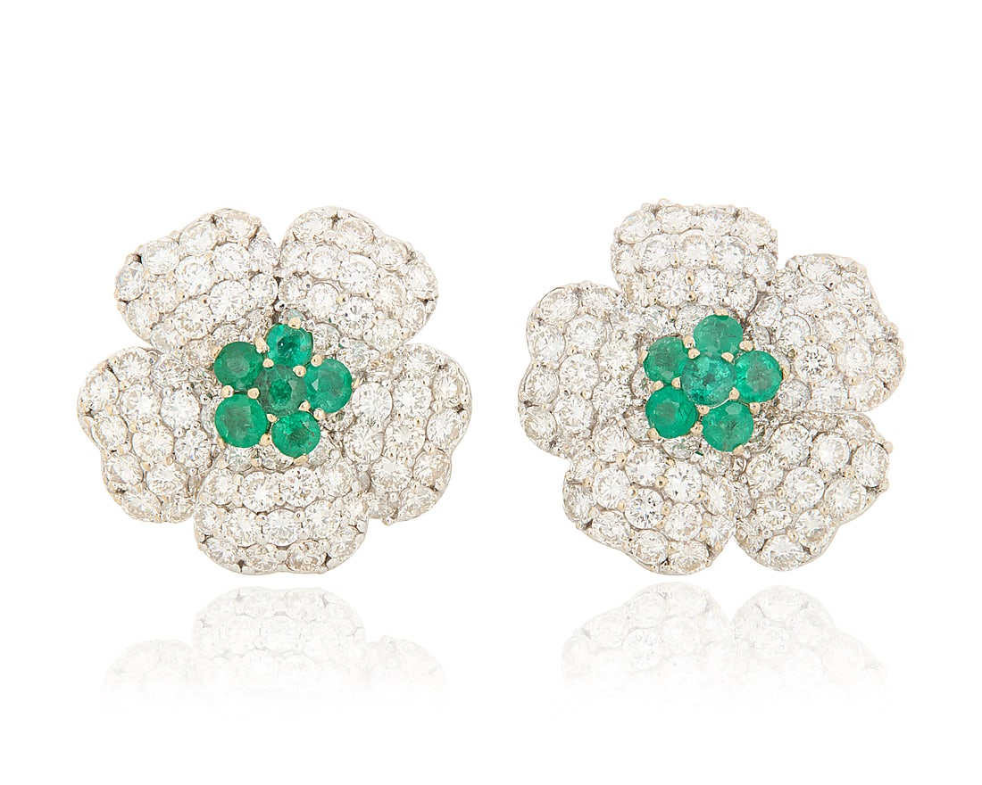 A Pair of 18K White Gold, Emerald and Diamond Earrings Of a floral design, centering round: A Pair of 18K White Gold, Emerald and Diamond Earrings Of a floral design, centering round emeralds, with petals accented by round diamonds weighing approximately 4.80 carats 2 pieces Measures: 1 x 1 