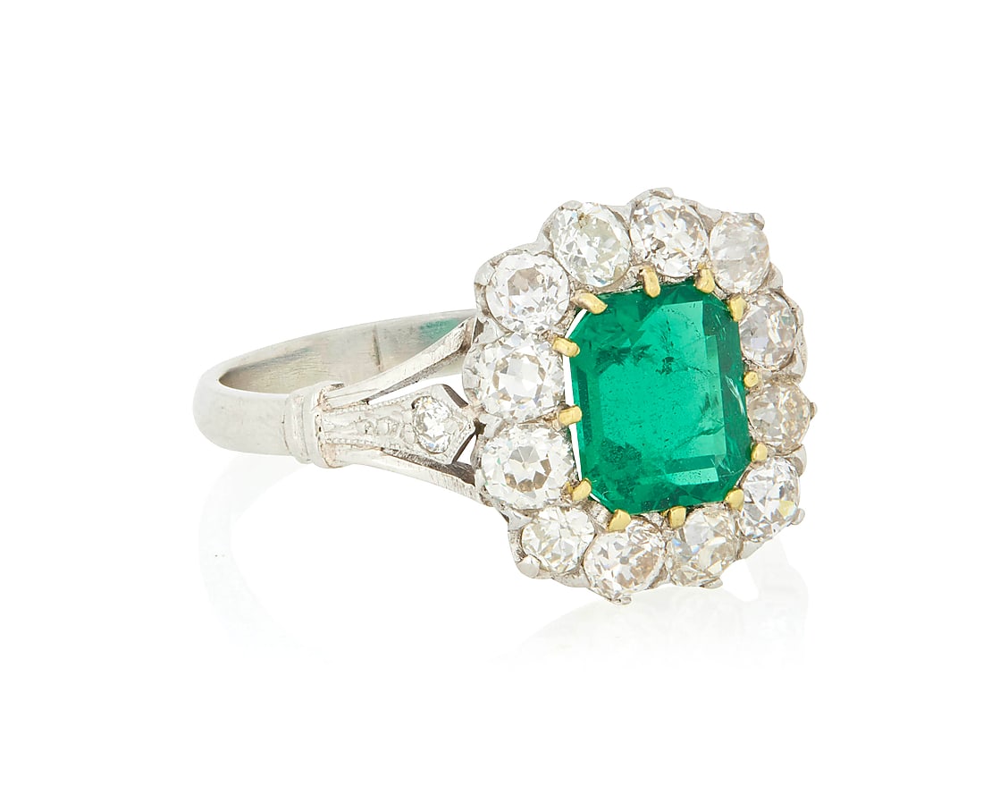 A Platinum, Emerald and Diamond Ring Centering an octagonal-cut emerald weighing approximately (1 of 2)