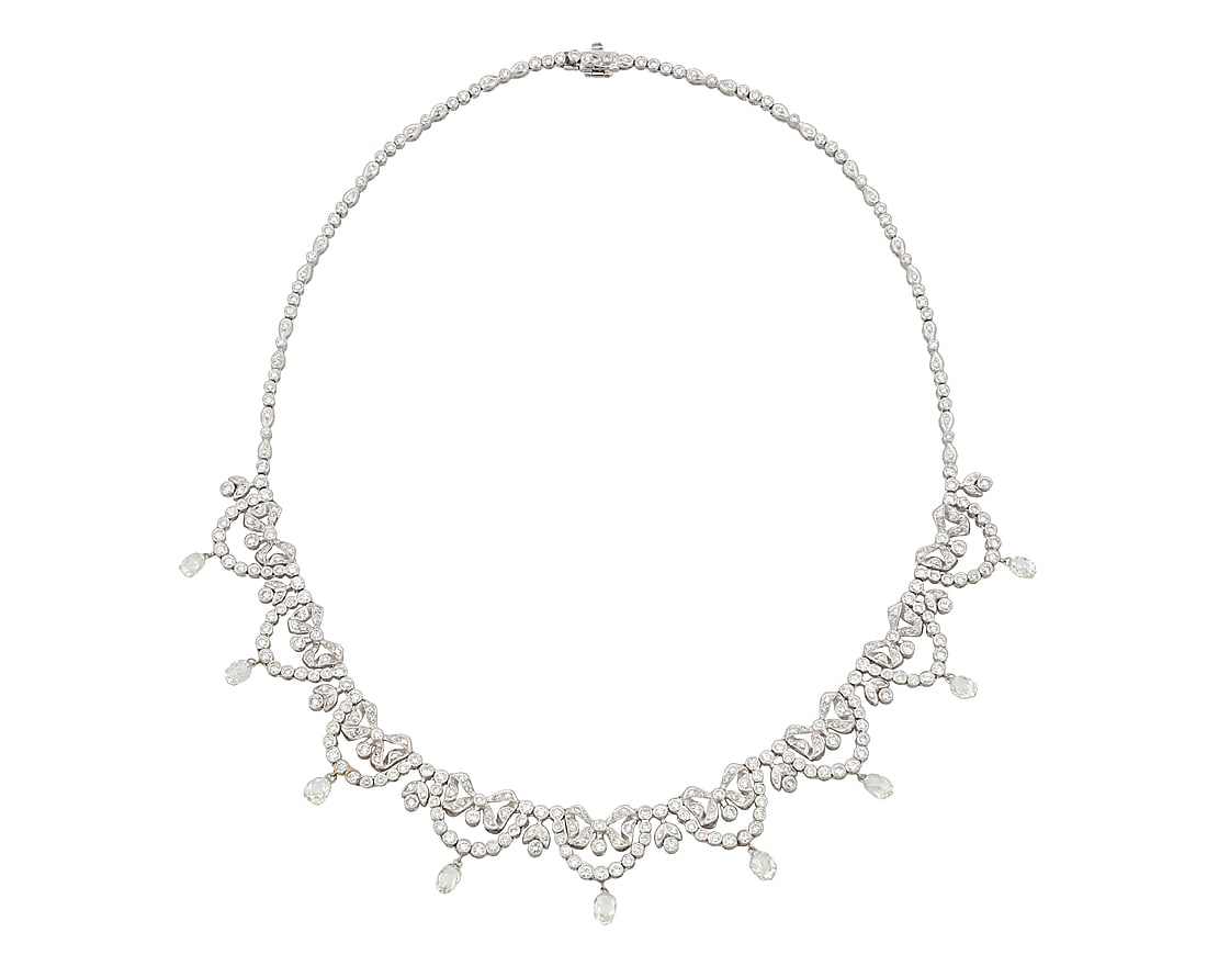 An 18K White Gold and Diamond Necklace Of a garland design featuring bow and scalloped motifs set (1 of 3)