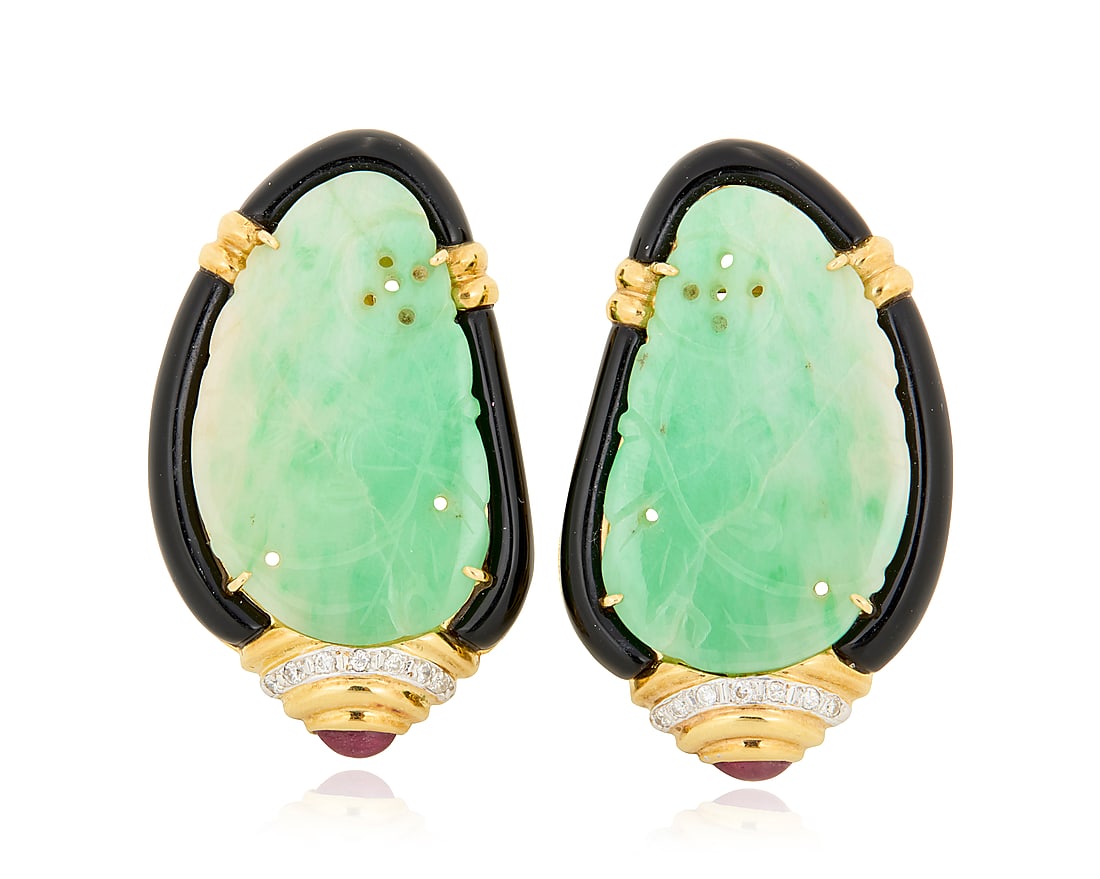 A Pair of 18K Gold, Jade and Gem-Set Earrings Centering carved jade tablets of an organic design: A Pair of 18K Gold, Jade and Gem-Set Earrings Centering carved jade tablets of an organic design encased by carved onyx, accented by round diamonds and finished with two oval ruby cabochons 2 pieces M