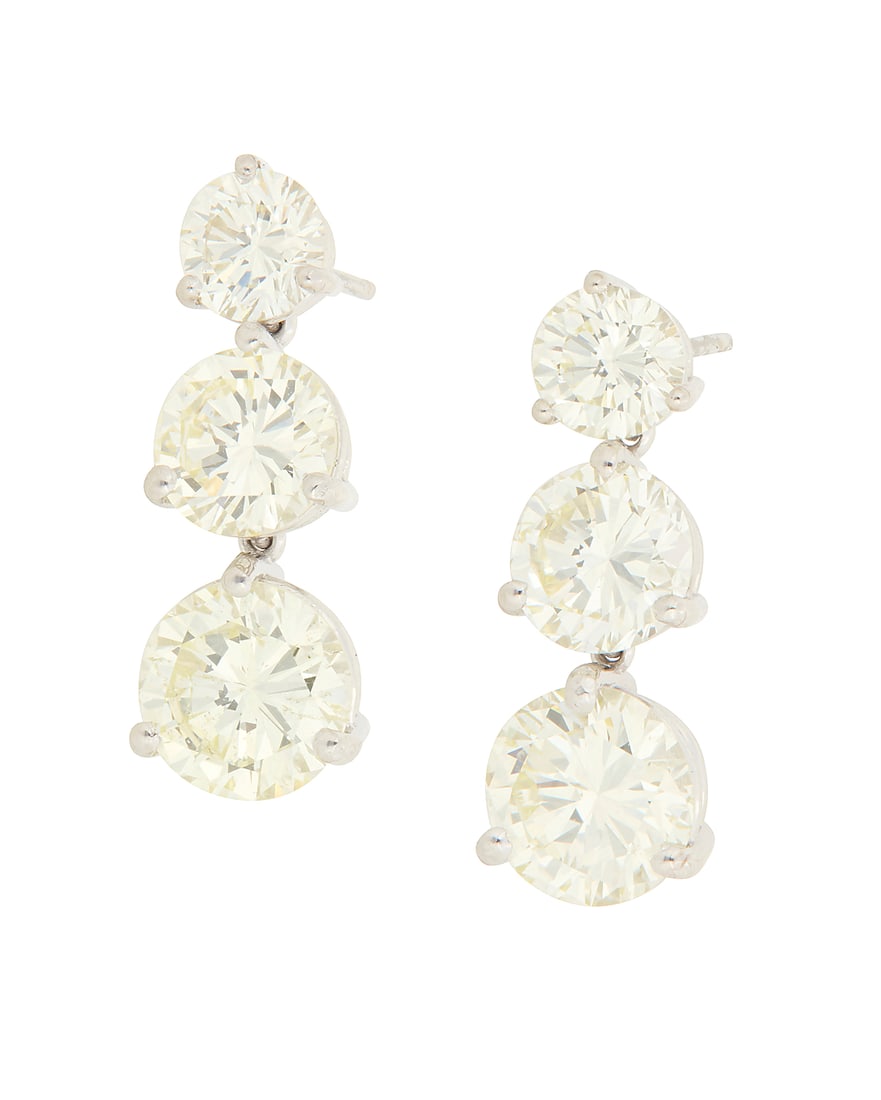 A Pair of 18K White Gold and Diamond Earrings Featuring six graduated diamonds weighing (1 of 3)