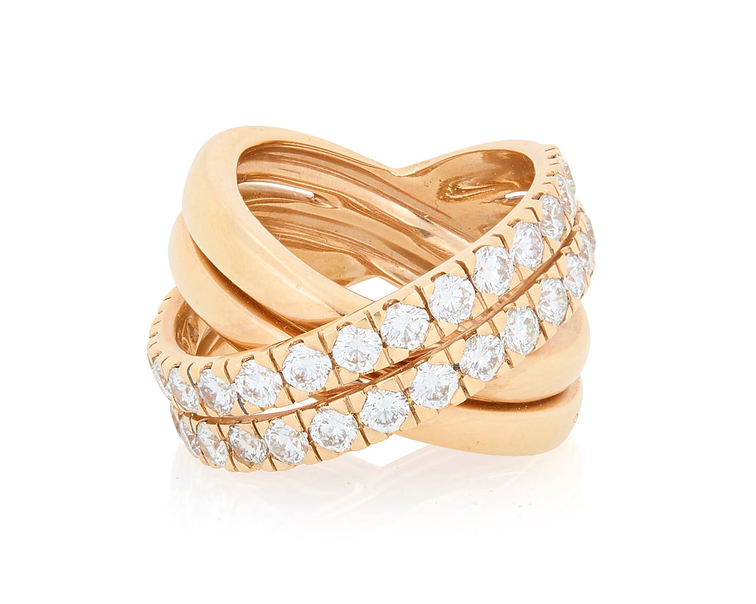 An 18K Rose Gold and Diamond Ring Of a cross over design featuring two bands of high polish rose: An 18K Rose Gold and Diamond Ring Of a cross over design featuring two bands of high polish rose gold accented by two rows of round diamonds weighing approximately 2.50 carats Size: 6 1/2 15.7 grams g