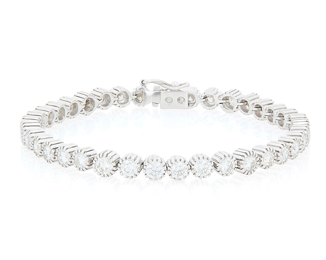 An 18K White Gold and Diamond Bracelet Featuring thirty-seven round diamonds weighing (1 of 3)
