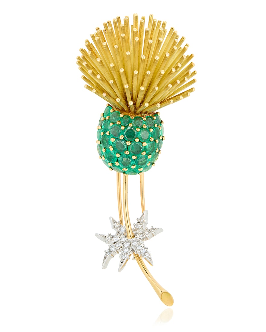 An 18K Gold, Platinum, Emerald and Diamond Brooch Of a thistle design accented by round emeralds,: An 18K Gold, Platinum, Emerald and Diamond Brooch Of a thistle design accented by round emeralds, featuring leaves set with single-cut diamonds, with French assay marks Measures: 3 x 1 in. 35.2 grams 