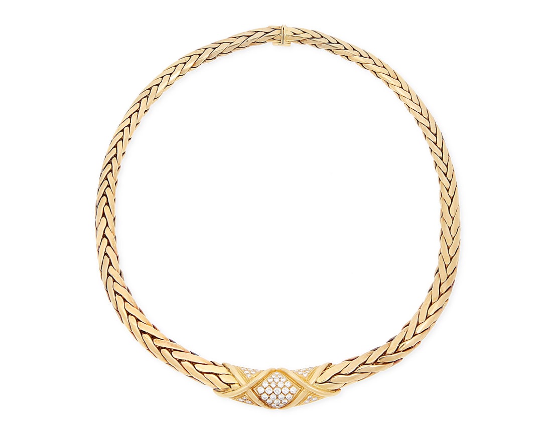 An 18K Gold and Diamond Necklace Featuring a fancy braided link chain, centering a high polish (1 of 3)