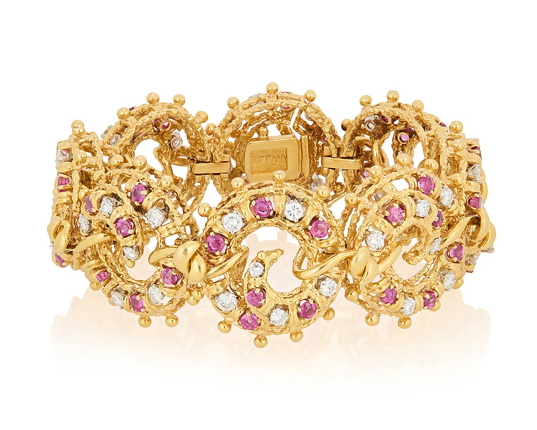 Tiffany & Co.: An 18K Gold and Diamond Bracelet Featuring nautical style links accented by round: Tiffany & Co.: An 18K Gold and Diamond Bracelet Featuring nautical style links accented by round rubies, and round diamonds weighing approximately 4.32 carats, signed Tiffany Length: 6 1/4 in., Width: