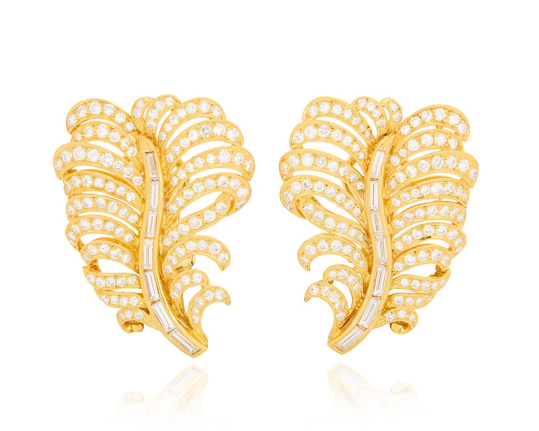 A Pair of 18K Gold and Diamond Earrings Of a feather design set with baguette and round diamonds (1 of 3)