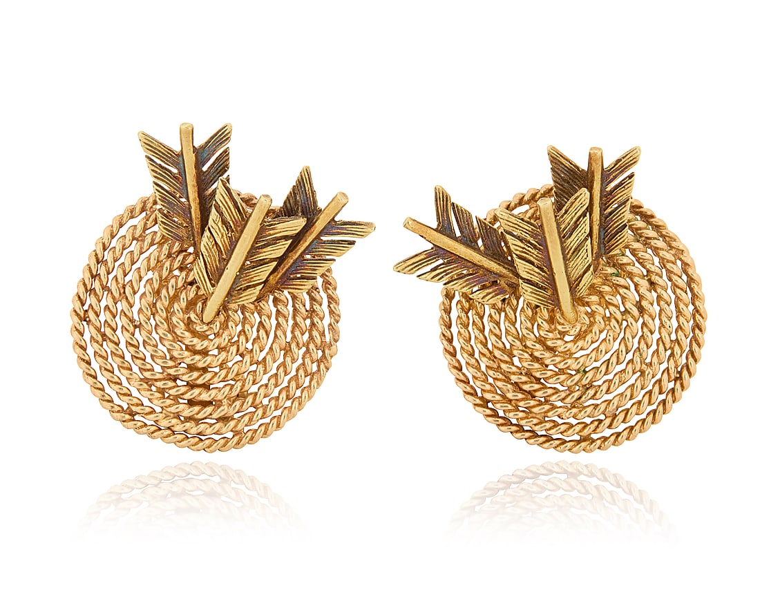 A Pair of 14K Gold Earrings Featuring three arrows piercing twisted gold targets 2 pieces: A Pair of 14K Gold Earrings Featuring three arrows piercing twisted gold targets 2 pieces Measures: 1 x 1 in. 16.6 grams gross