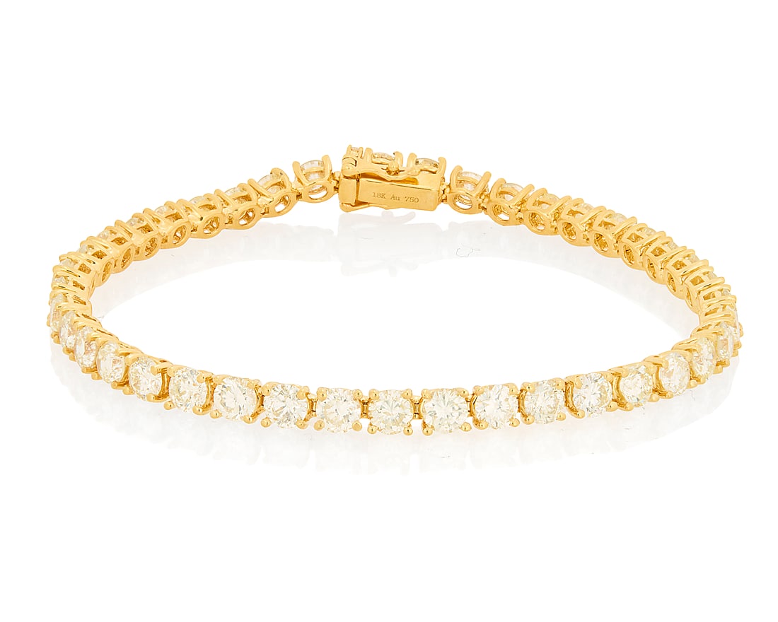 An 18K Gold and Diamond Bracelet Featuring forty round diamonds weighing approximately 8.85 carats (1 of 3)
