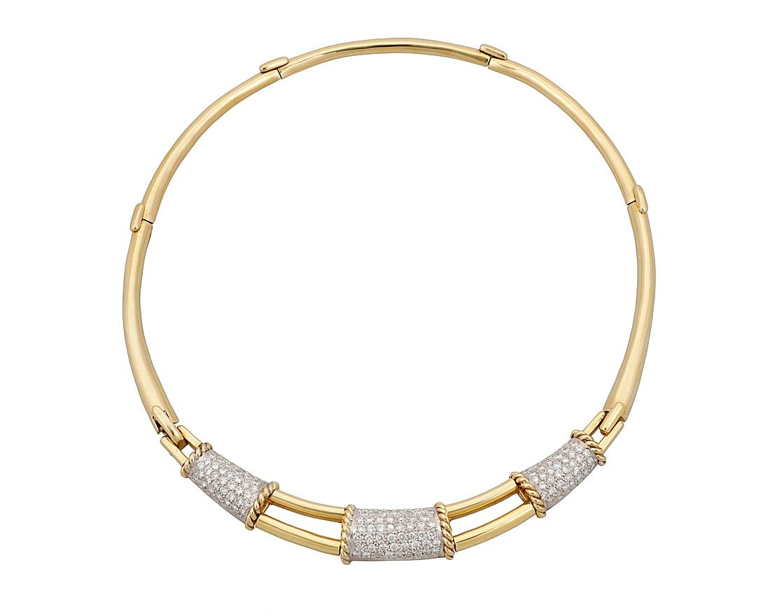 An 18K Bi-Color Gold and Diamond Necklace Including a central panel featuring three bands of white: An 18K Bi-Color Gold and Diamond Necklace Including a central panel featuring three bands of white gold set with round diamonds weighing approximately 5.30 carats, accented by a twisted yellow gold de