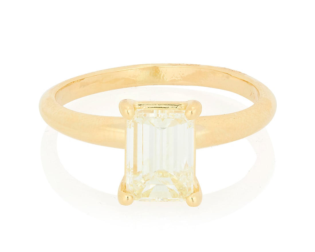 A 14K Gold and Diamond Ring Centering a solitaire emerald-cut diamond weighing approximately 1.40: A 14K Gold and Diamond Ring Centering a solitaire emerald-cut diamond weighing approximately 1.40 carats Size: 6 3/4 3.0 grams gross