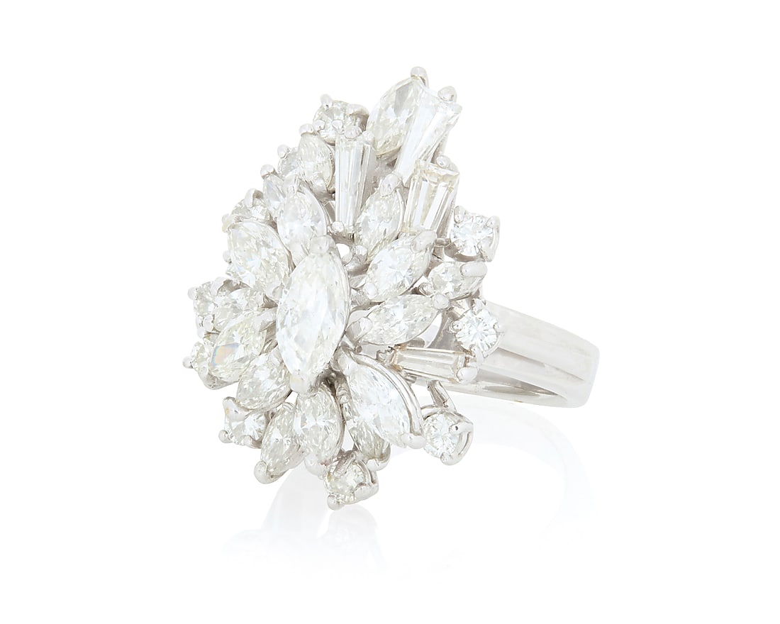 An 18K White Gold and Diamond Ring Of a cluster design featuring marquise-shaped, tapered baguette (1 of 3)