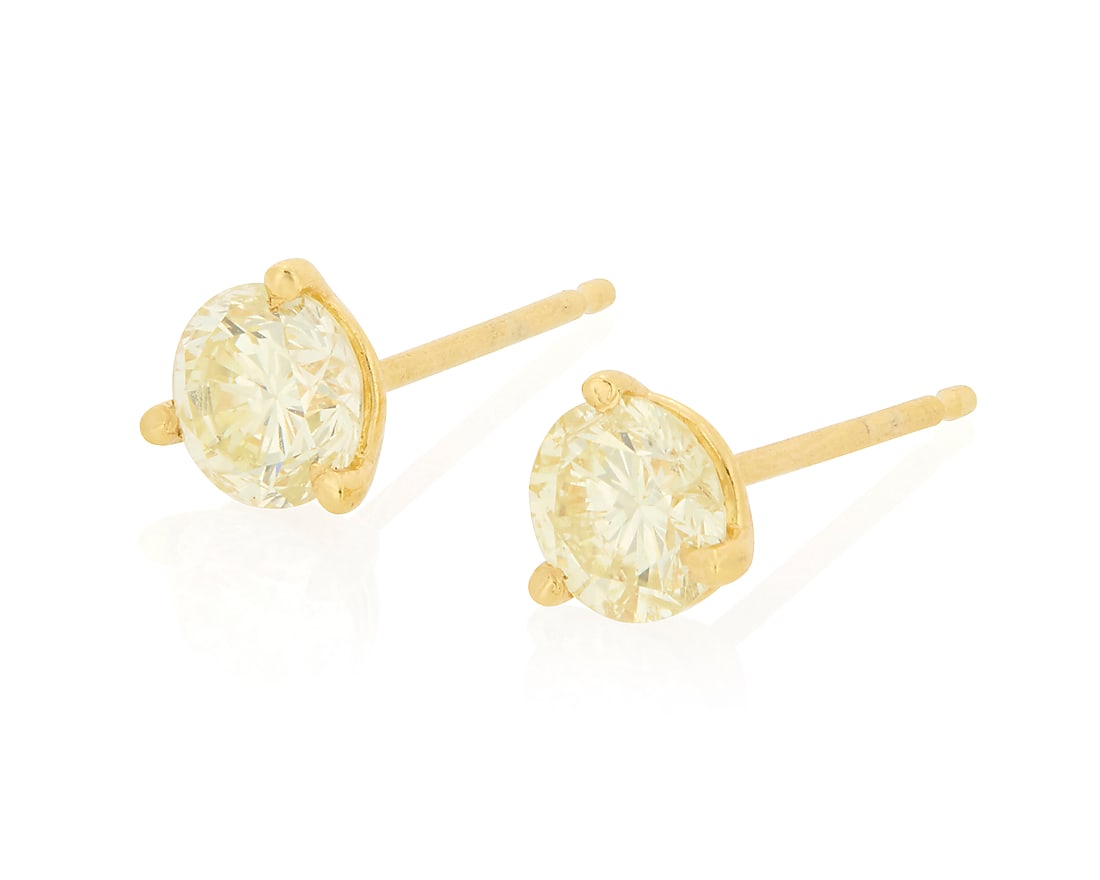 A Pair of 14K Gold and Diamond Stud Earrings Centering two round diamonds weighing 1.06 carats (1 of 3)