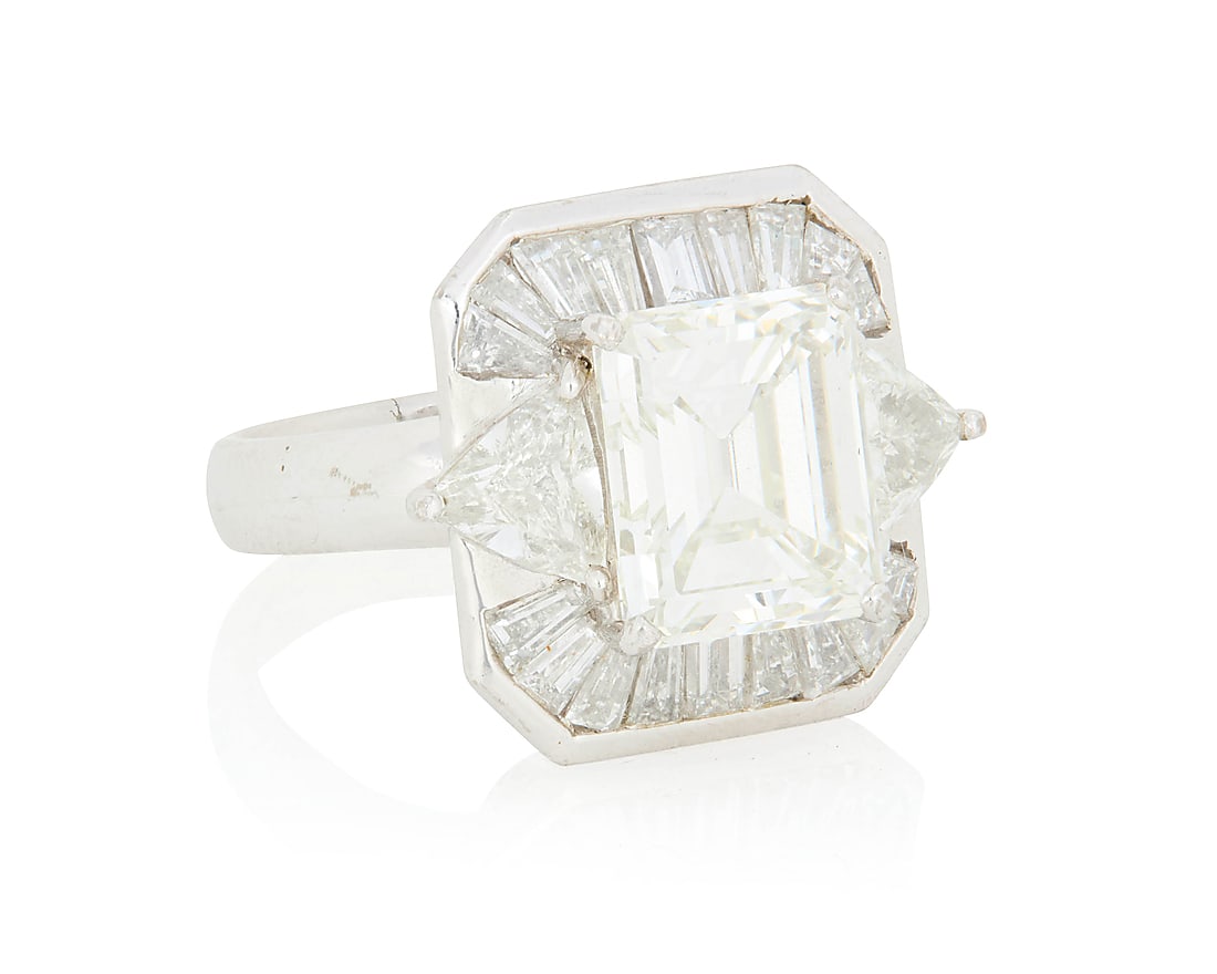 An 18K White Gold and Diamond Ring Centering an emerald-cut diamond weighing 4.17 carats, accented (1 of 5)