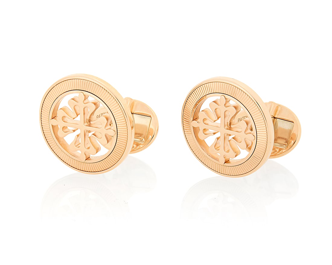 Patek Philippe: A Pair of 18K Rose Gold 'Calatrava Cross' Cufflinks Featuring a quatrefoil cross: Patek Philippe: A Pair of 18K Rose Gold 'Calatrava Cross' Cufflinks Featuring a quatrefoil cross design, signed Patek Philippe Geneva 2 pieces Measures: 3/4 in. 16.9 grams gross