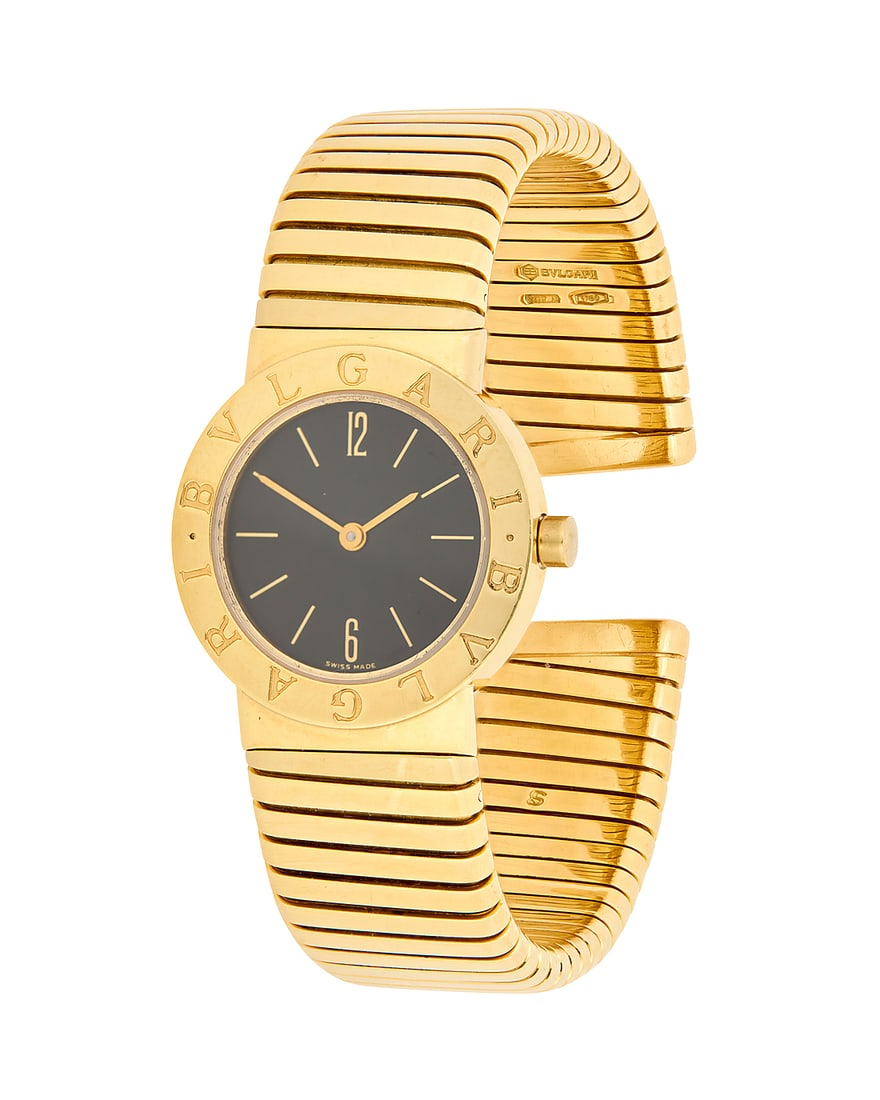 Bulgari: And 18K Gold Tubogas Wristwatch Dial: 19.00 mm, round black dial with baton hour markers: Bulgari: And 18K Gold Tubogas Wristwatch Dial: 19.00 mm, round black dial with baton hour markers Case: 28.00 mm Case number: 438, BB 26 2T, P.71921 Closure: tubogas bracelet cuff Signed: dial, case a