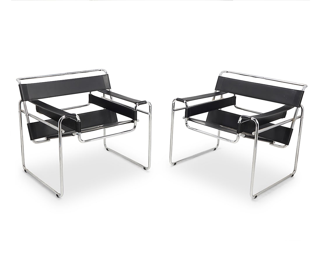 After Marcel Breuer (1902-1981) A pair of armchairs after the 'Wassily' armchairs for Knoll, late: After Marcel Breuer (1902-1981) A pair of armchairs after the 'Wassily' armchairs for Knoll, late 20th century Designed 1925 Each tubular chromed metal frame with black leather sling seat, back strapp
