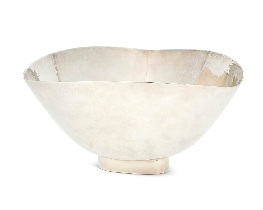 A Modern hammered sterling silver center bowl Mid-20th century Impressed to underside: DEMATTEO /: A Modern hammered sterling silver center bowl Mid-20th century Impressed to underside: DEMATTEO / HAND HAMMERED / STERLING / 320 Height 5 1/2 in., width 10 1/4 in., depth 10 1/4 in. 25.8 oz. troy appr