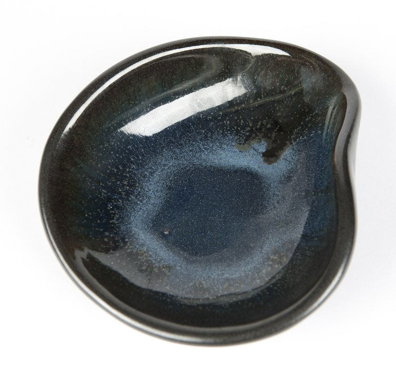 E. Deutch, a glazed pottery dish: 1952, signed and dated ''E. Deutch / 1952'' (Eugene Deutch 1904 - 1959 American), triangular, covered in glossy charcoal and indigo glaze, 1.875'' H x 6.375'' W x 5.5'' D, est: $400/600