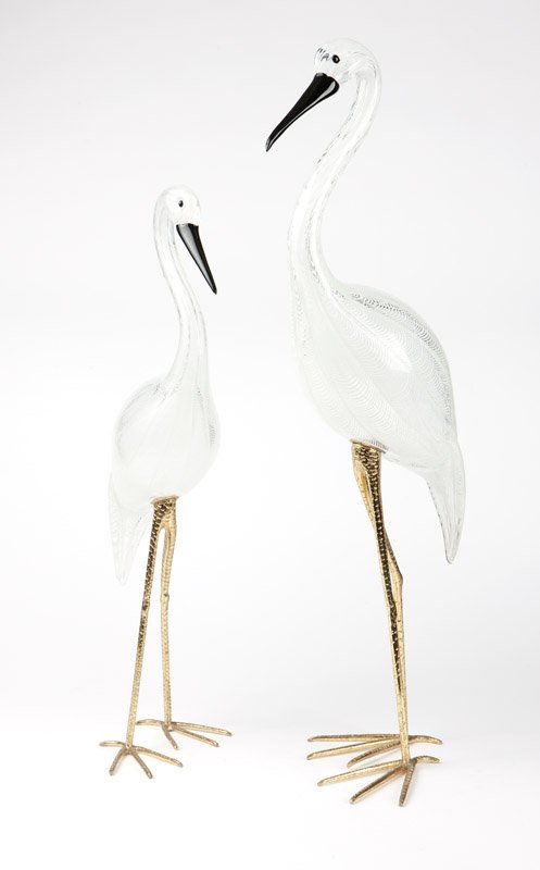 Licio Zanetti, two glass & gilt metal cranes: Circa 1985, Murano, Italy, each with engraved signature to underside of body ''Zanetti L.'', each of hand-blown clear glass with opaque white fluted striations and with a black beak and black eyes, 2 