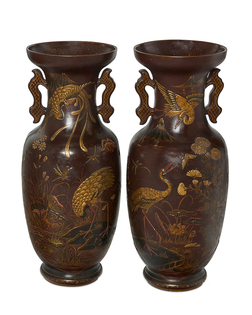 A pair of Japanese style painted ceramic floor vases mounted as uplights: A pair of Japanese style painted ceramic floor vases mounted as uplights 20th century With ruyi-form handles, each decorated in relief with cranes, butterflies, and foliage in a pond vignette, each ho
