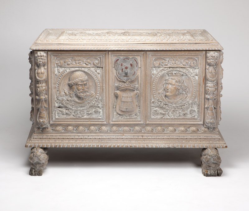 A Renaissance style limed wood cassone: 19th century, elaborately carved with gadroon, shell and leaf tip borders to top, front and sides and with caryatids to the four corners, the rectangular hinged lid with a frieze of classical figures 
