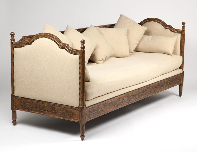 A French Provincial style carved walnut sofa / daybed
