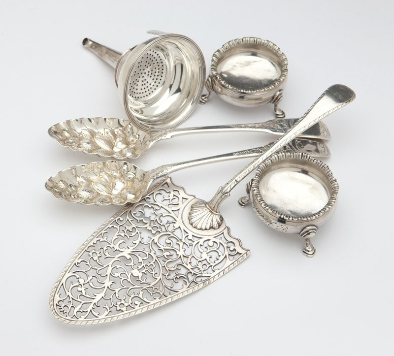 A group of Georgian sterling silver: Comprising: 1 pair of salt cellars, London, 1766, maker's mark ''AN / IS'', inscribed ''1764'', monogrammed ''SPHB'' (1.375'' H x 2.375'' Dia.); 1 funnel, with partially obscured maker's mark and sove