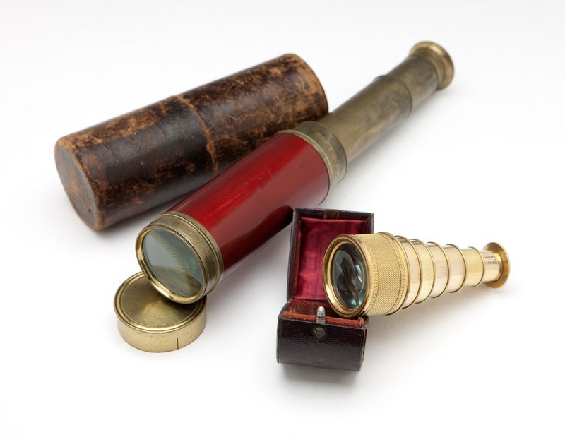 Two English telescoping spyglasses: 19th century, the first signed ''G. Richardson / St. Catherines / London'', of brass, the barrel painted red, eight-draw, with lens cap (open length 29.25''), the second signed ''Adams / London'', of 