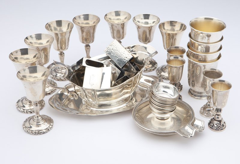 A group of silver articles by various makers: 20th century, each marked for sterling, comprising: 1 gravy boat and 1 under plate by Reed & Barton, 12 salt bowls by Shreve & Co., 8 cordials by Sanborns, 4 liqueurs with unidentified maker's mark, 4