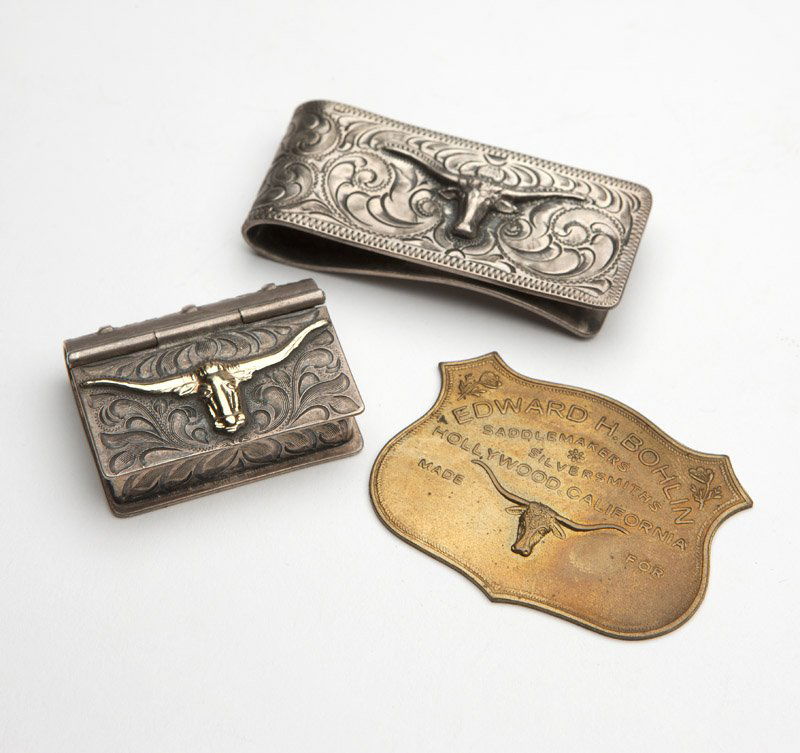 A Bohlin money clip & plaque & a Vogt pill box: The money clip marked ''Edw. H. Bohlin, Co. / Maker / Hollywood, Cal.'' with steer head, stamped ''.925'' and ''SK'', and ''EHB / B'', (2.25'' H x 1'' W) (1.285 oz troy); the plaque marked ''Edward H.