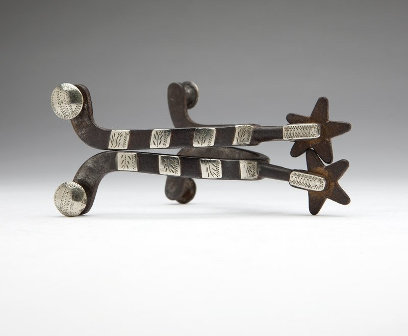 A pair of McChesney spurs: Marked ''McChesney'', double-mounted with silver overlay, 2 pcs, est: $300/400