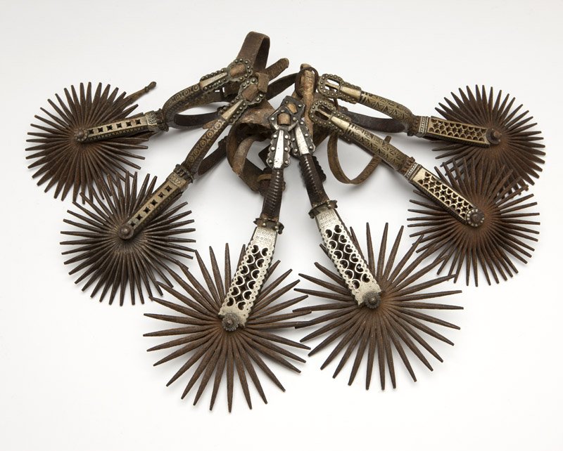 Three pairs of large South American spurs: Each silver-overlaid, 6 pcs, est: $400/700