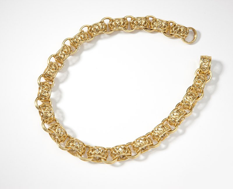 A Paloma Picasso for Tiffany & Co gold necklace: Signed ''Paloma Picasso, Tiffany & Co'', in 18K gold, fancy link with connecting ''X'' oval links, 17'', 193.7 gms, est: $4500/5500