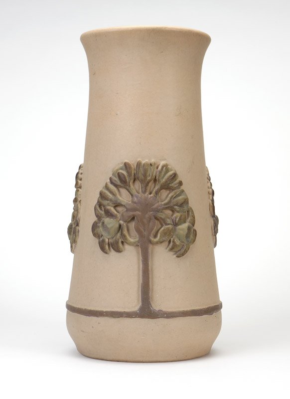 A Rookwood Pottery umbrella stand / floor vase: 1900, Cincinnati, OH, with ''RP'' mark with 14 flames, impressed ''1066 BY'', further marked ''9'', the slightly flared rim over a spreading cylindrical body decorated in high relief with three styliz