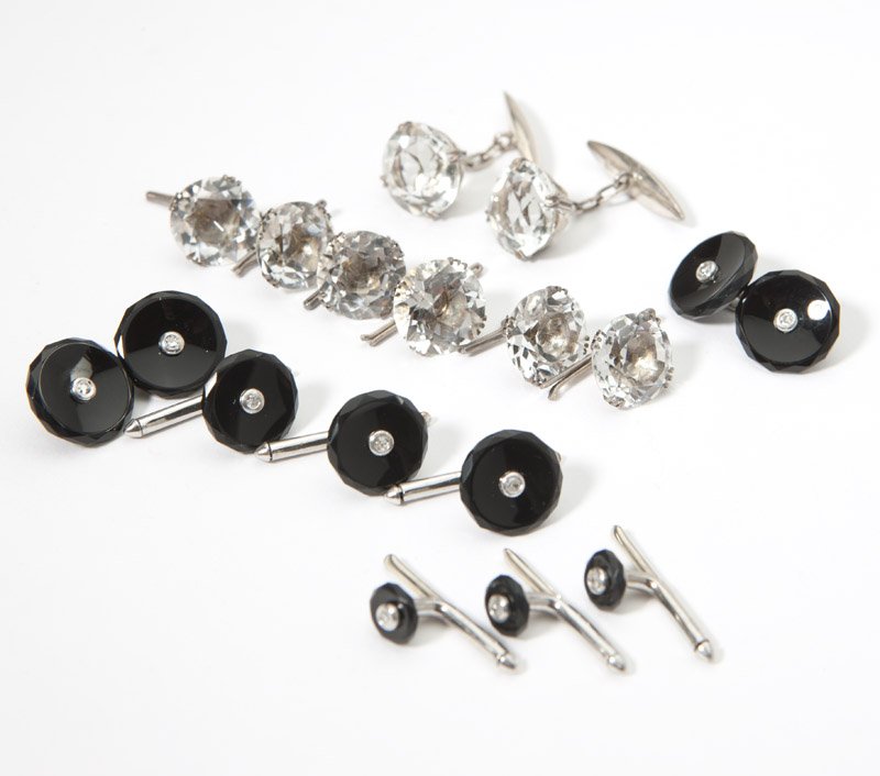 A collection of two dress sets: One set of eight made from onyx with single-cut diamond accents and 14K white gold, the other set of eight made of faceted rock crystal and silver with unknown Japanese mark, 16 pcs, est: $800/1200
